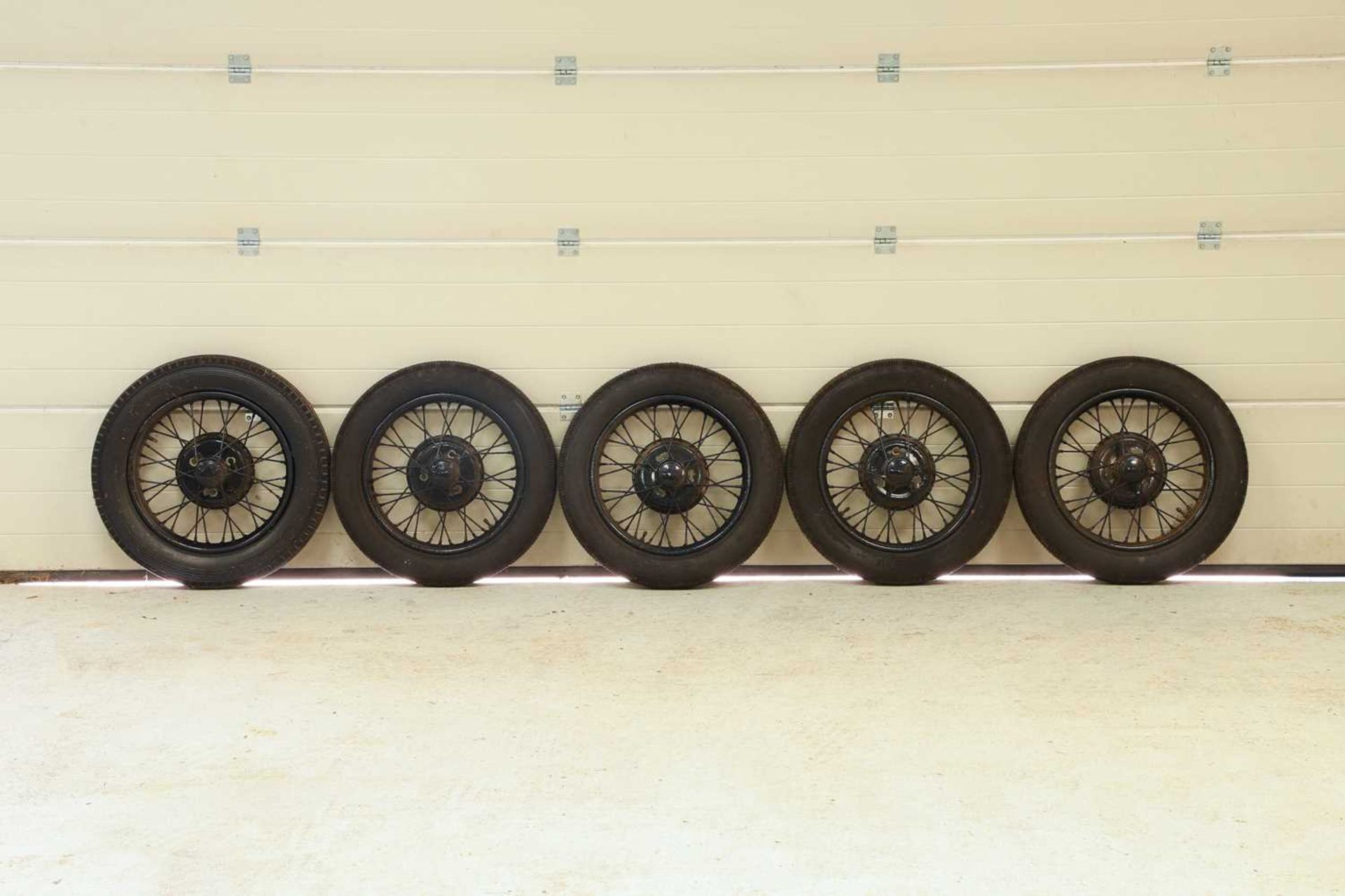 A set of five Austin 7 wheels,