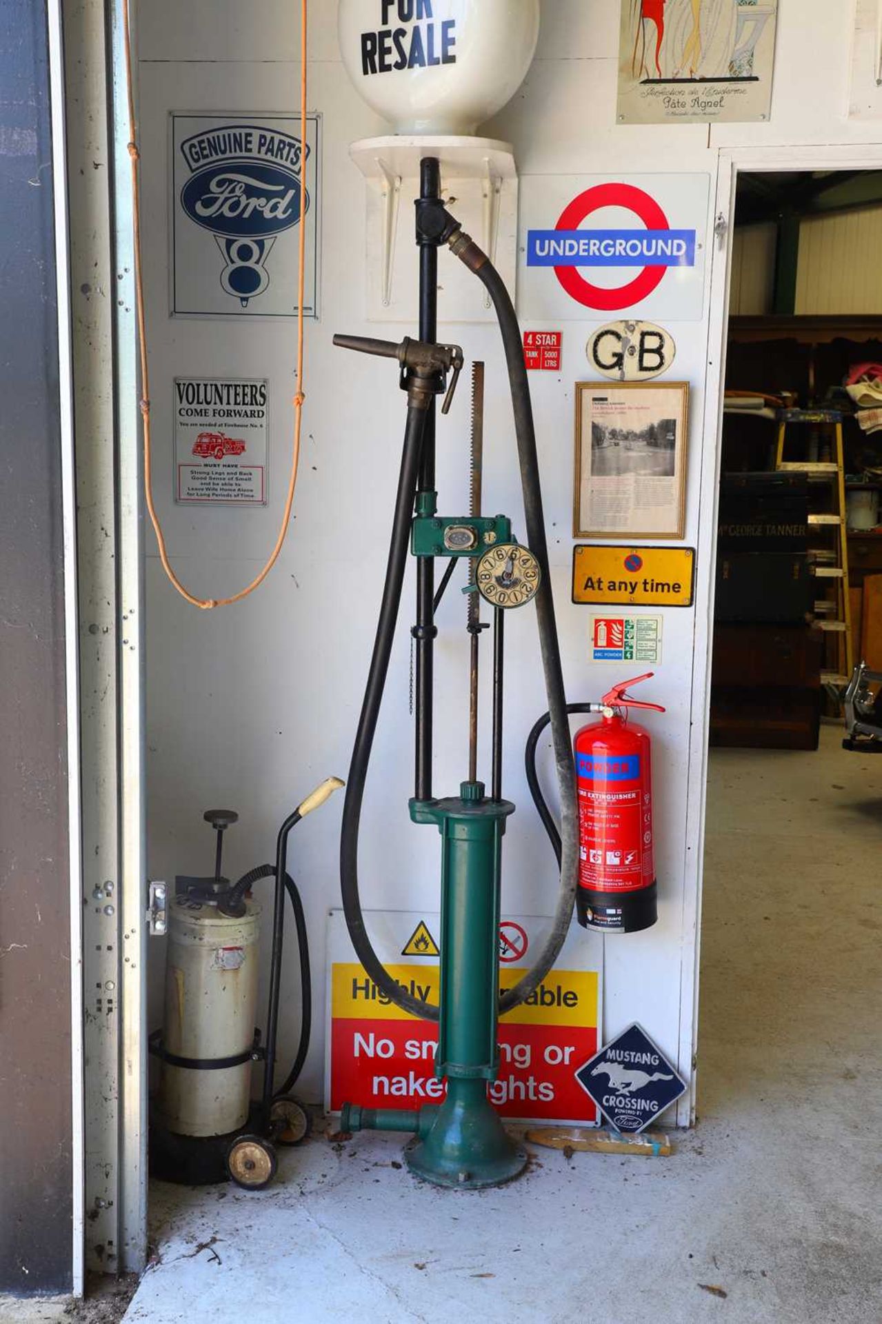 A 'Gilbarco' pre-war hand-crank petrol pump,