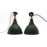 A pair of green Holophane ceiling lights,