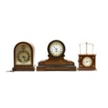 A group of three mantel clocks
