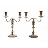 A pair of silver twin-light candelabra