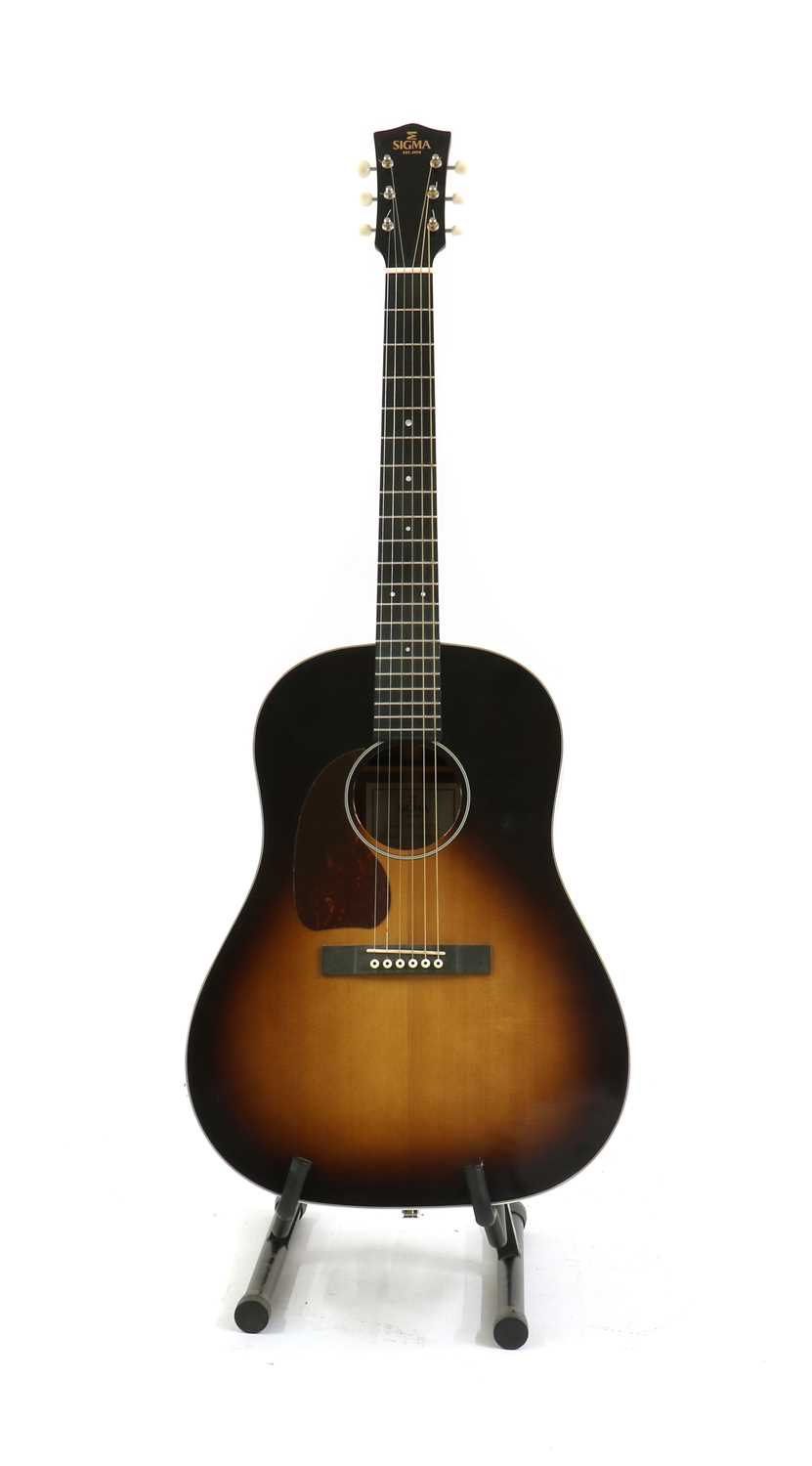 A left handed Sigma electro-acoustic guitar,