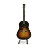 A left handed Sigma electro-acoustic guitar,