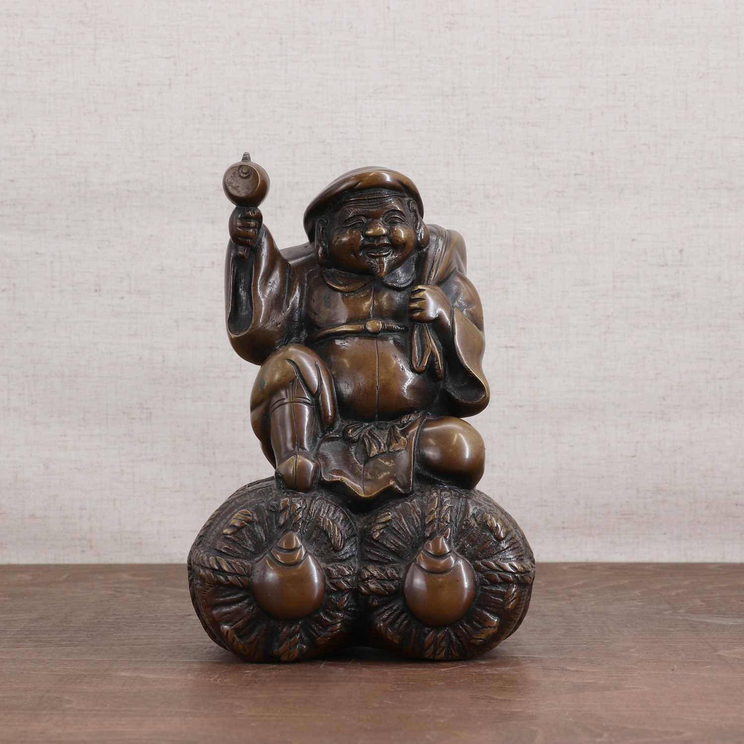 A Japanese bronze figure,