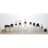 A collection of silver-mounted cut glass dressing table bottles