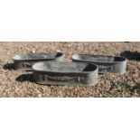 Three small round end lead troughs