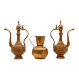 A near pair of Indo-Persian copper coffee pots or ewers