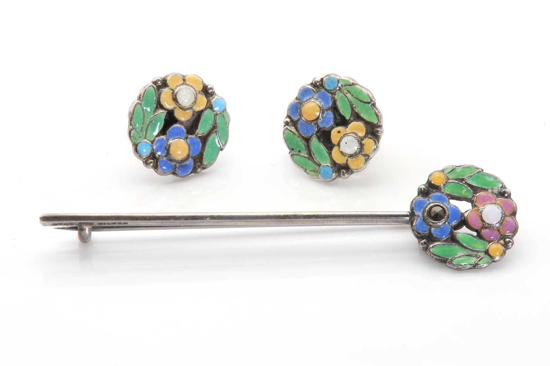 An Arts and Crafts floral bar brooch attributed to Bernard Instone,