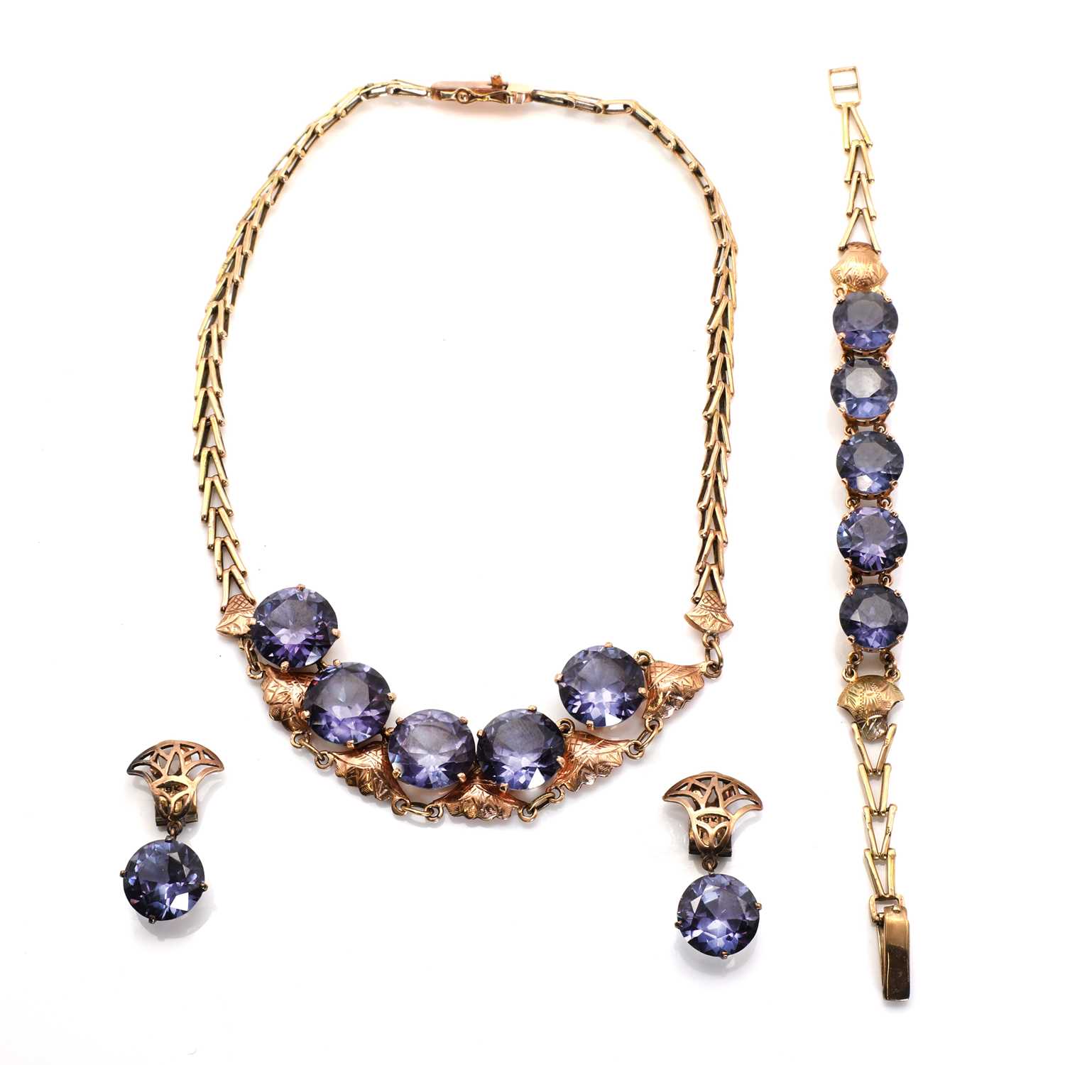 A gold and synthetic colour change sapphire jewellery suite,