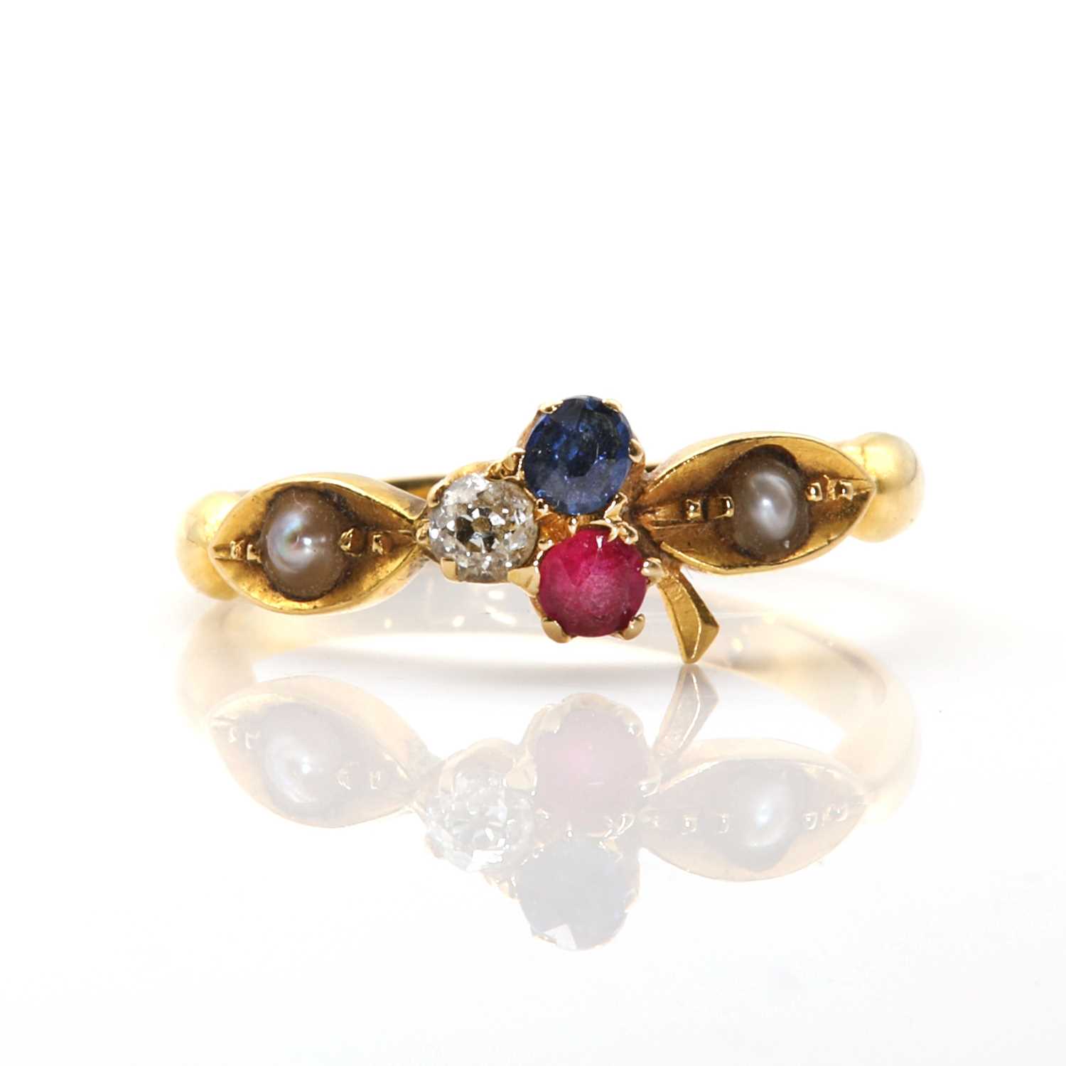 A late Victorian ruby sapphire and diamond trefoil ring,
