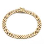 A three colour gold brick link bracelet,