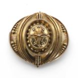 A Victorian archaeological revival style shield brooch,