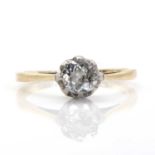 A gold single stone diamond ring,