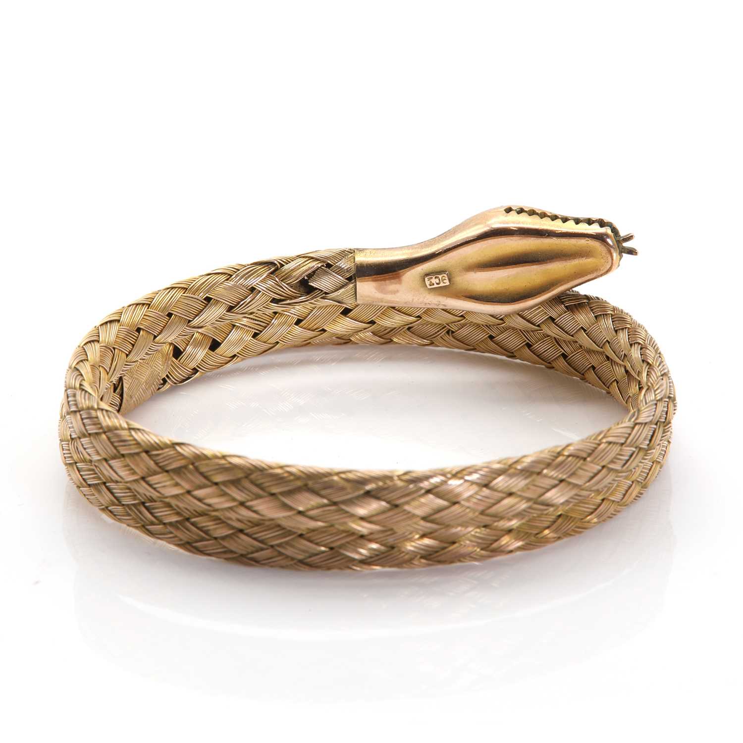 A gold coiled snake flexible bangle, - Image 2 of 3