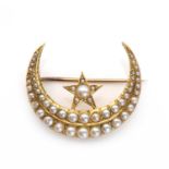 A Victorian gold split pearl star and crescent brooch,