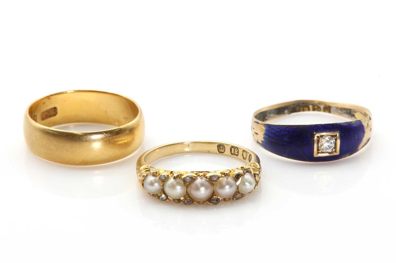 Two Edwardian 18ct gold rings,