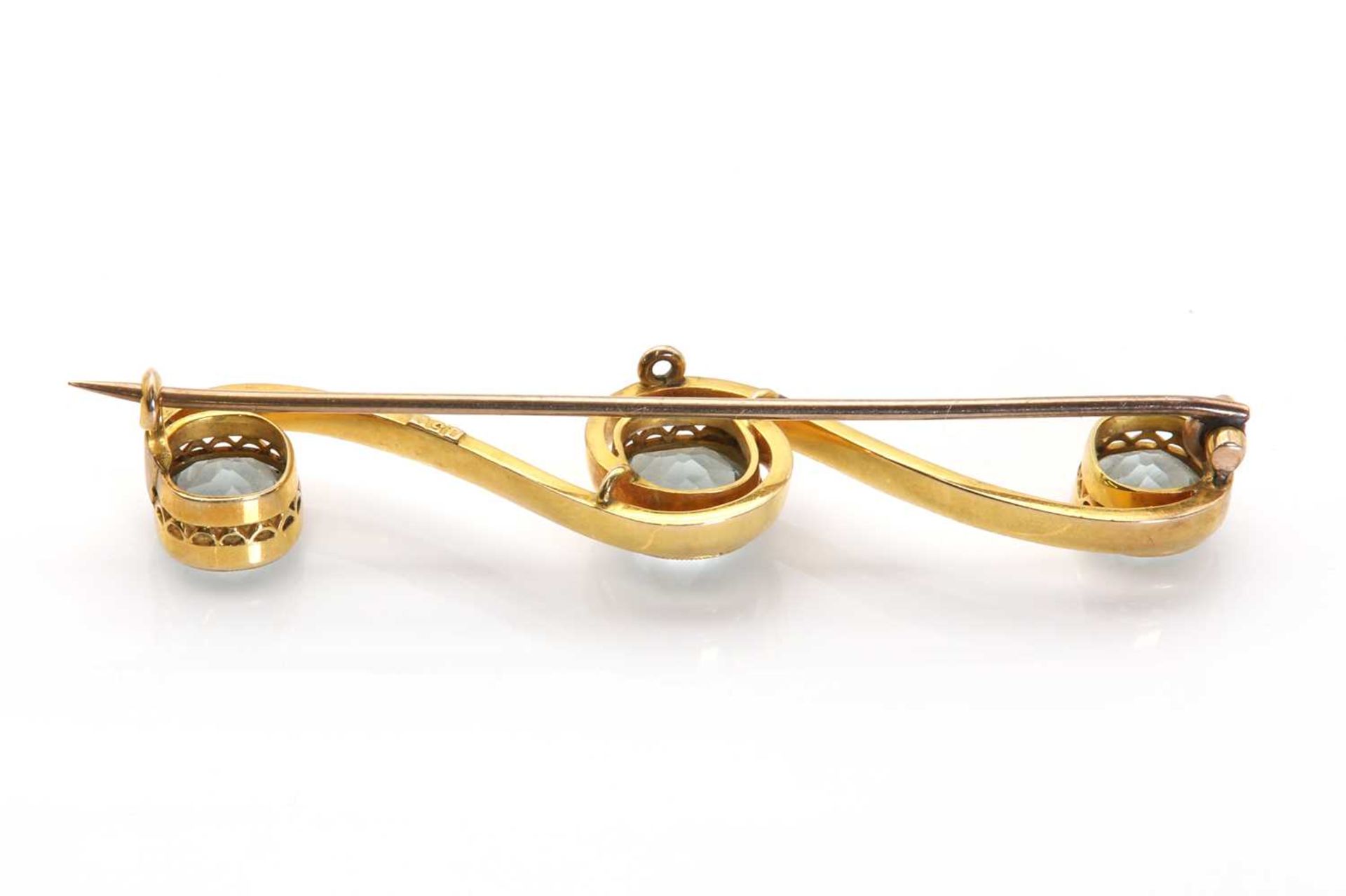 An early 20th century gold and paste scrolling bar brooch, - Image 2 of 2