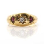 An 18ct gold diamond and garnet three stone ring,