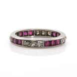 A platinum ruby and diamond eternity ring,