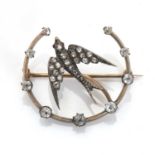 A diamond set swallow and crescent brooch,
