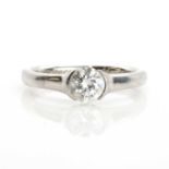 A single stone diamond and platinum ring,