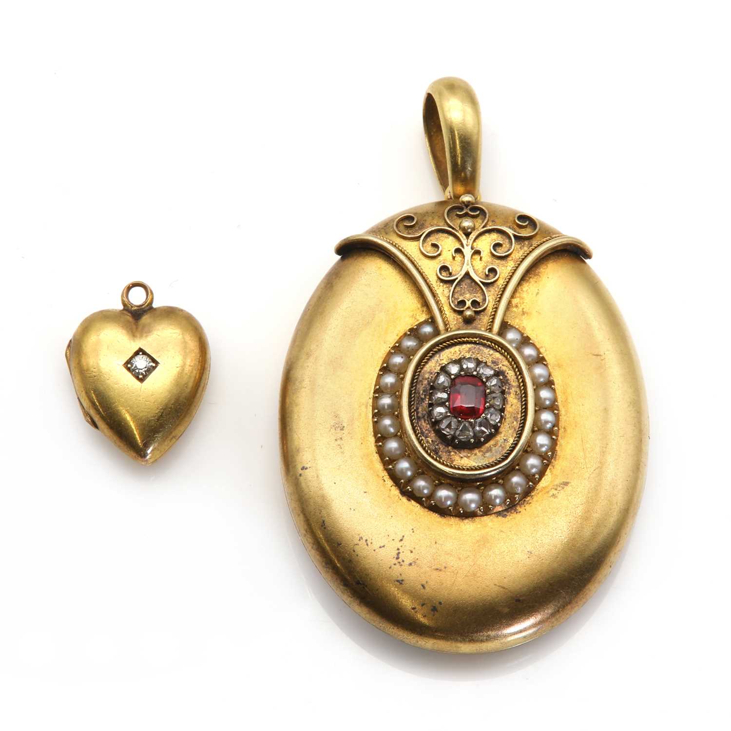 A late Victorian split pearl, diamond and garnet topped doublet memorial locket,