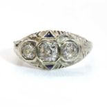 An American Art Deco three stone diamond and synthetic sapphire ring,