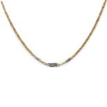 An 18ct yellow and white gold diamond set necklace, c.1985,