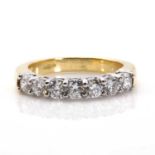 An 18ct gold diamond set half eternity ring,