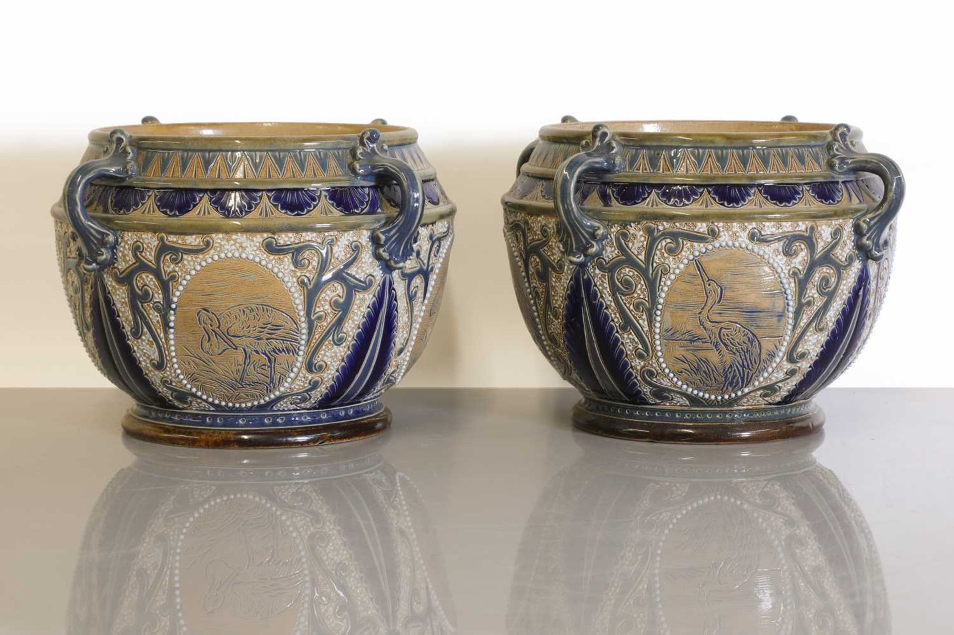 A pair of Doulton Lambeth stoneware jardinières,