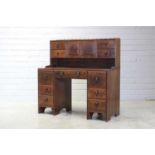 An Arts and Crafts walnut desk,
