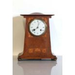 An Art Nouveau oak mantel clock,