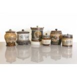 Six Doulton Lambeth stoneware tobacco jars and biscuit barrels,