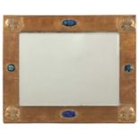 An Arts and Crafts copper wall mirror,