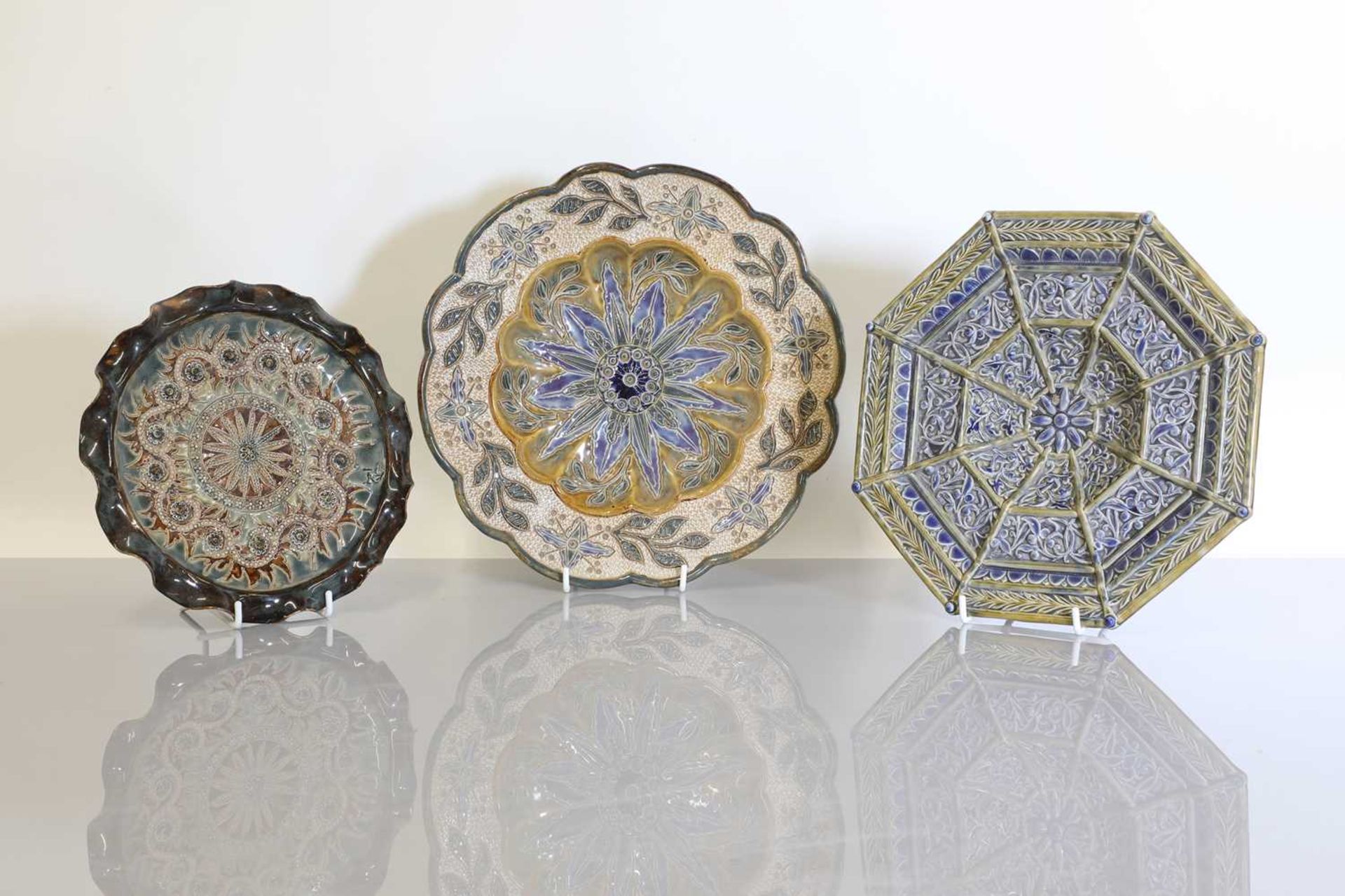 Three Doulton Lambeth stoneware plates,