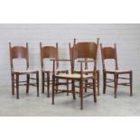 A set of four Arts and Crafts elm dining chairs,