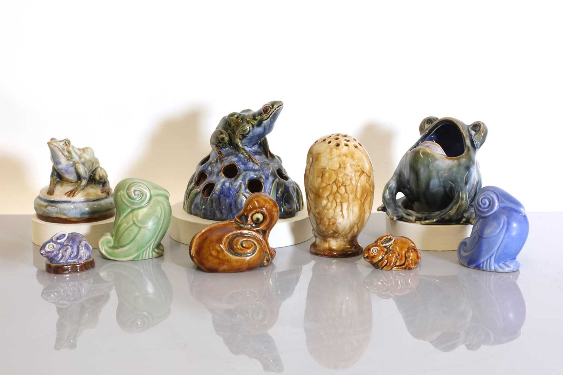 A collection of eight Doulton Lambeth and Royal Doulton stoneware animals,