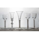 A group of four drinking glasses,