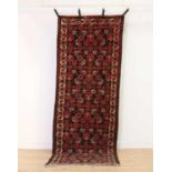 A Persian wool runner,