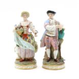 A pair of porcelain Meissen style figures,