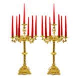 A pair of ecclesiastical gilt metal candelabra