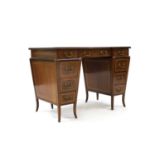 An Edwardian strung mahogany twin-pedestal desk,