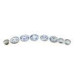 A collection of Chinese blue and white teacups and saucers,