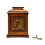 A mahogany and walnut mantel clock,