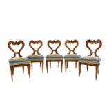 A set of five Biedermeier walnut chairs,