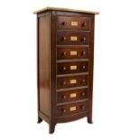 A cherrywood chest of drawers,