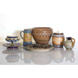 A collection of six Doulton Lambeth and Royal Doulton stoneware items,