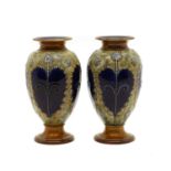 A pair of Royal Doulton stoneware vases,
