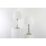 A pair of silver-plated table lamps,