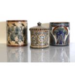 A Doulton Lambeth stoneware tobacco jar and two pots,